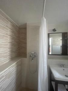a bathroom with a shower and a sink at Studio Apartman Lana 3 in Ičići +7 photos