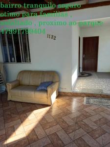 a living room with a couch in a room at Apartamento1 beto carreiro cozinha compartilhada in Penha