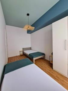 Postel nebo postele na pokoji v ubytování Apartament Rubin