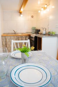 a kitchen with a table with plates on it at La serena in San Carlos de Bariloche