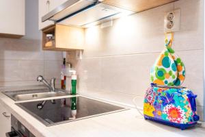 a kitchen with a sink and a bag on the counter at Apartment Giardino in Split +40 photos