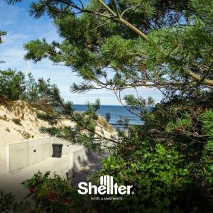 a view of the ocean from a tree at Seaside Shellter Rogowo in Rogowo