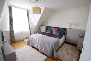 Posteľ alebo postele v izbe v ubytovaní Aranyhaj Apartman