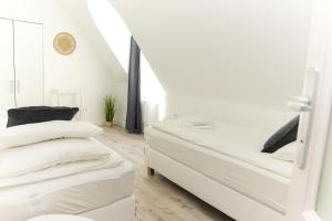 Posteľ alebo postele v izbe v ubytovaní Raba92 Apartman House
