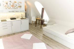 Posteľ alebo postele v izbe v ubytovaní Raba92 Apartman House