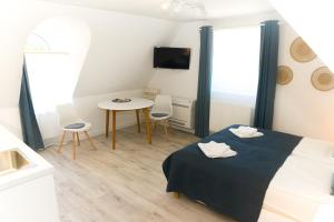 Posteľ alebo postele v izbe v ubytovaní Raba92 Apartman House