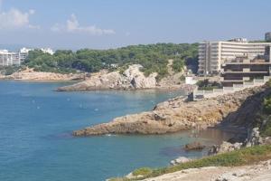 a view of a body of water with some rocks at Apartment in Salou. Beach Relax HUTT-033474-91 in Salou