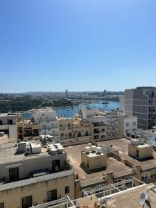 an aerial view of a city with buildings at Eleven by Warren Collection in Sliema