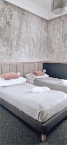 Posteľ alebo postele v izbe v ubytovaní Wygodne Pokoje H114