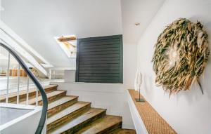 a staircase with a green door in a house at 3 Bedroom Lovely Apartment In Poitiers in Poitiers +13 photos