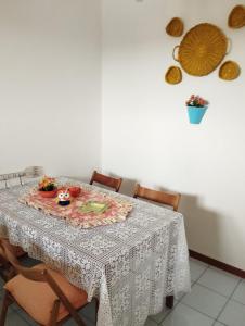 a dining room table with a table cloth on it at CRISTIN B&B in Monfalcone