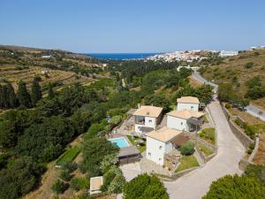 an aerial view of a villa with a house and a road at Iro Suites in Andros