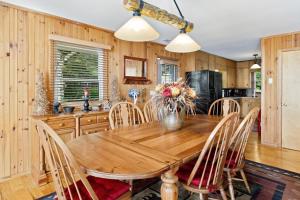 a kitchen with a wooden table and chairs at Golden Ridge Getaway in Blowing Rock