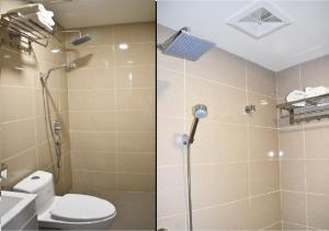 a bathroom with a shower with a toilet and a sink at ECO HOTEL at BB in Kuala Lumpur