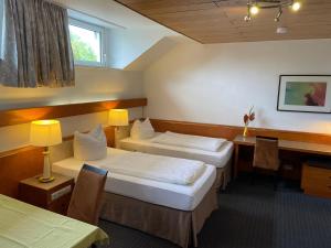 Cama ou camas em um quarto em Gästezimmer Gasthof Becker