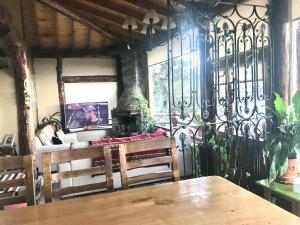 a dining room with a table and a fireplace at Morada del Leñador in Ushuaia