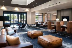 a lobby with couches and chairs and a table at Courtyard Seattle Downtown/Lake Union in Seattle