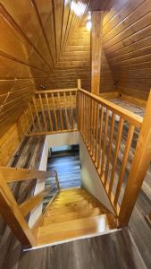 an overhead view of a wooden staircase in a cabin at Penzion Loket in Loket