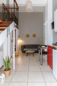 a living room with a couch and a table at A & D Houses in Patra
