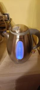 a metal tea kettle sitting on a table at I Templari - Affittacamere in Castignano
