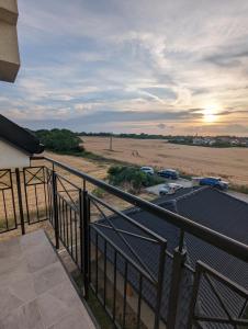 a view of a field from the balcony of a house at N&H Pansion 