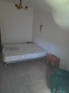 מיטה או מיטות בחדר ב-Appartamenti mastromatteo