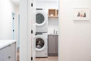 a laundry room with a washer and dryer in it at Cabot Views by Revelstoke Vacations in Revelstoke