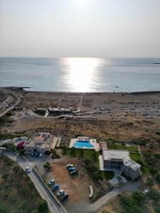 an aerial view of a parking lot next to the ocean at Panorama Hotel in Falasarna