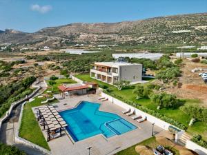 an aerial view of a house with a swimming pool at Panorama Hotel in Falasarna