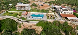 an aerial view of a house on a mountain at Panorama Hotel in Falasarna