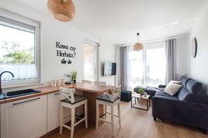 TV a/nebo společenská místnost v ubytování Apartament Beti Sun Gdańsk