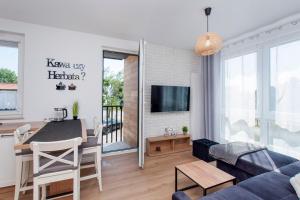 TV a/nebo společenská místnost v ubytování Apartament Beti Sun Gdańsk