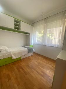 Postel nebo postele na pokoji v ubytování Apartman Nika