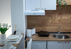 A cozinha ou kitchenette de Apartman Elle