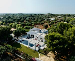 an aerial view of a white house in the countryside at Villa Kalorama-private pool & Hot Tub in San Vito dei Normanni