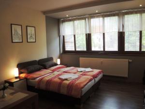Postel nebo postele na pokoji v ubytování Apartmany Rudolf + 37 fotografií