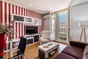 TV a/nebo společenská místnost v ubytování Waou Apartamentos en Sol Superior 2