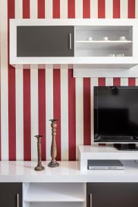 TV a/nebo společenská místnost v ubytování Waou Apartamentos en Sol Superior 2