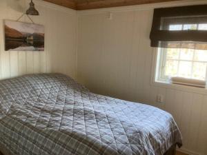 Spurveslottet - cabin by the amazing Trollheimen tesisinde bir odada yatak veya yataklar
