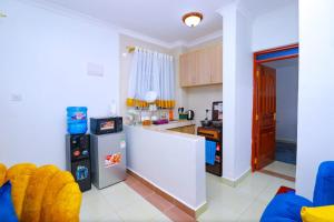 Kuchyň nebo kuchyňský kout v ubytování One bedroom near garden city