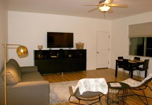 a living room with a couch and a flat screen tv at Eagle View Haven in Prescott