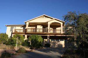 a large house with a balcony on a street at Eagle View Haven in Prescott