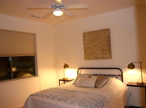 a bedroom with a bed and a ceiling fan at Eagle View Haven in Prescott