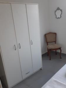 Postel nebo postele na pokoji v ubytování Dinos Apartments