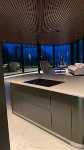 a kitchen with a large island in a room at Madla.Villa in Stavanger