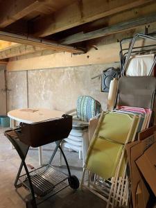 a room with a table and chairs in it at Maison familiale in Saint-Pierre-dels-Forcats