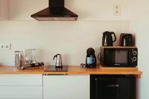 a kitchen with a counter with a microwave and a microwave at inspiramar in Benicarló