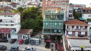 an aerial view of a city with buildings and cars at Diamond Hotel & Restaurant Ulcinj in Ulcinj