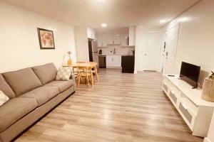 a living room with a couch and a table at Unit #201 Cozy Mountain View 1BR in DT in Canmore