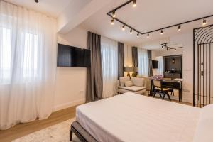 a bedroom with a bed and a living room at Palazzo Romano Suite 2 in Split